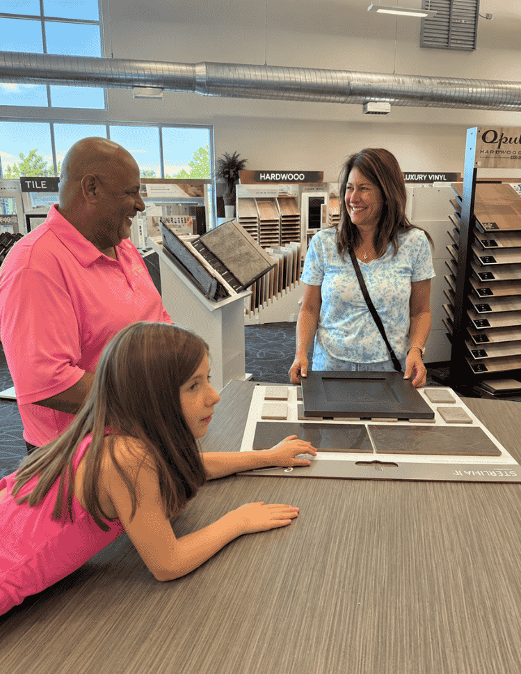 sales associate Tana helping customers with cabinetry